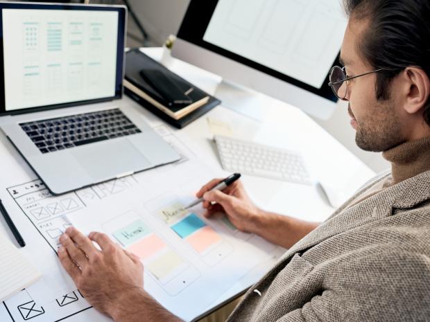man planning/working at desk