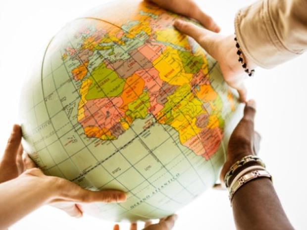 Hands holding a globe