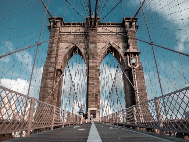 Point of view walking across the Brooklyn Bridge.