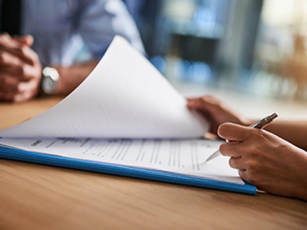person reviewing a form person reviewing a form